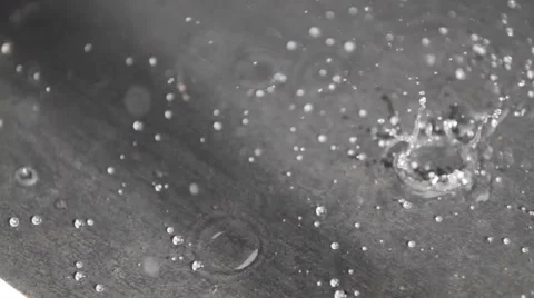 Rain drops falling on a surface Stock Footage 47323349