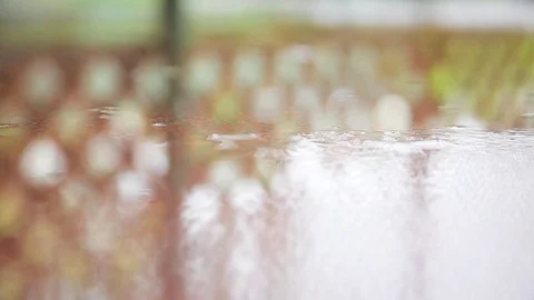 Rain drops falling on surface Stock Footage 76099889