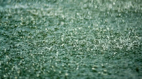 Rain drops falling on the surface of the lake Видео 39492873