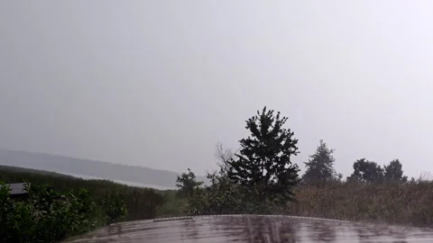 Rain Drops Falling on Wet Metallic Roof of Abandoned Trailer Stock Footage 339590430
