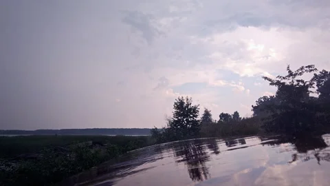 Rain Drops Falling on Wet Metallic Roof of Abandoned Trailer Stock Footage 339590764