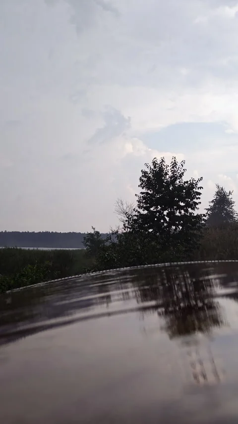 Rain Drops Falling on Wet Metallic Trailer Roof with Reflection Stock Footage 339621596