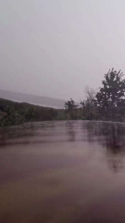 Rain Drops Falling on Wet Metallic Trailer Roof with Reflection Stock Footage 339621615