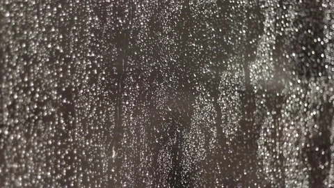 Rain drops falling on the window glass, selective focus, autumn colors. 動画素材 86486139