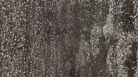 Rain drops falling on the window glass, selective focus, autumn colors. 動画素材 86486169