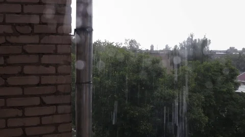 Rain drops falling on window pane Video stock 79592848