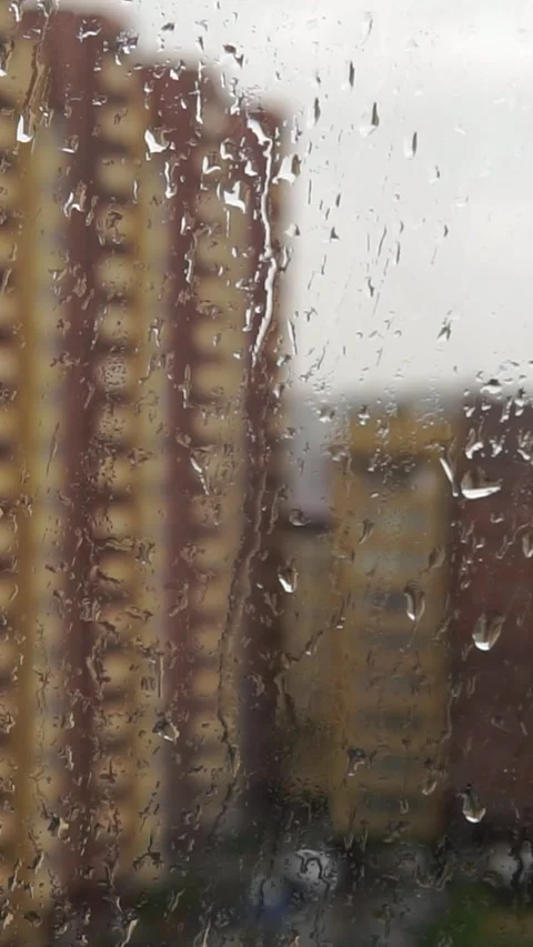 Rain Drops Flowing Down Window Glass City Buildings Background Stock Footage 346639840