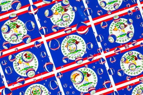 Rain drops full of Belize flags 库存照片