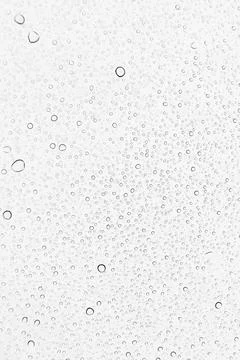 Rain drops on glass background Stock Photos