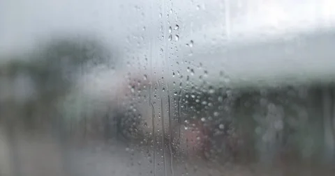 Rain drops on glass car window moving on the road Stock Footage 102961412