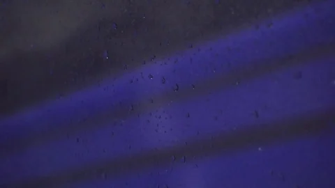 Rain drops on glass car window moving on the road Stock Footage 112436955