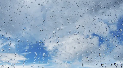 Rain drops on glass. Clous time lapse in background. Video stock 34832331