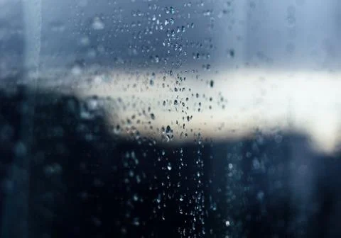 Rain drops on glass reflection 스톡 사진