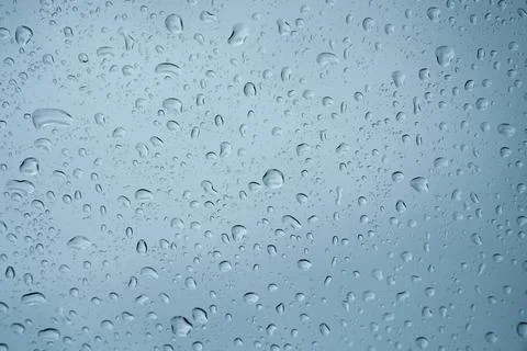 Rain drops on the glass surface. Stock Photos