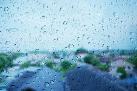 Rain drops on the glass surface. Stock Photos