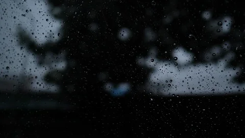 Rain drops on glass window in the dark night Stock Footage 94177500
