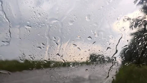Rain drops on glass windscreen, moody close-up Stock Footage 252926969