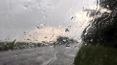 Rain drops on glass windscreen, moody close-up Stock Footage 252930359