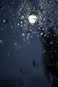 Rain Drops Hitting the Car Side Window Stock Photos