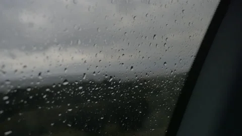 Rain drops on a moving car window, in New Zealand Stock Footage 218423617