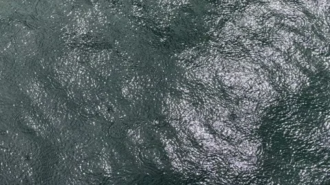 Rain drops on ocean Stock Footage 165083476