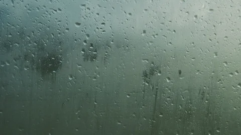 Rain drops on the outside of the windshield on a rainy day Stock Footage 118708559