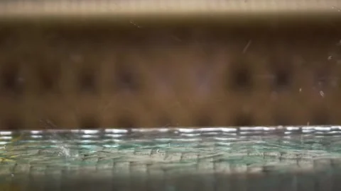 Rain drops on plastic table surface. Rainy day in the city. Video stock 255482838