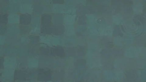 Rain drops on pool surface 動画素材 90654694