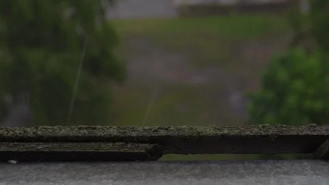 Rain drops pouring out of the window and sill - Foogy stormy weather Stock-Footage 114030671