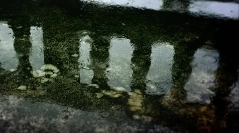 Rain drops on a puddle Stock Footage 10887329