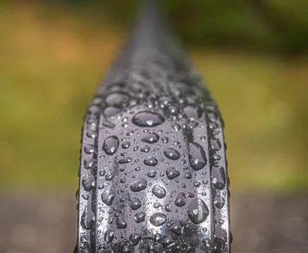 Rain drops on railings Stock Photos