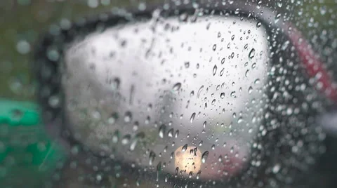Rain drops on the rear view mirror and side window 動画素材 60759436