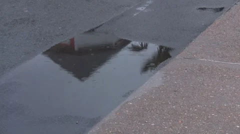 Rain drops on the road pavement sidewalk Stock Footage 7165272