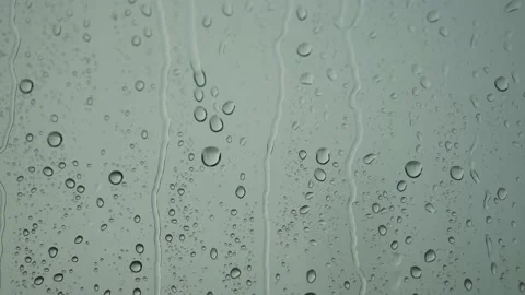 Rain drops roll down on the window. Bad depressive weather, heavy rain and wind Stock Footage 162489956