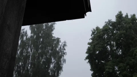 Rain drops from roof Stock Footage 77537855