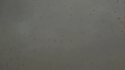Rain drops run down window pane, huge forked lightning sparkles Stock Footage 80433337