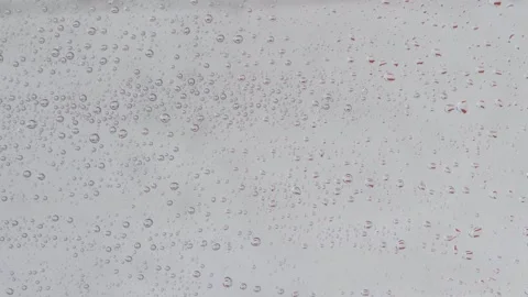 Rain drops runnin down the window glass at rainy day Stock Footage 252025709