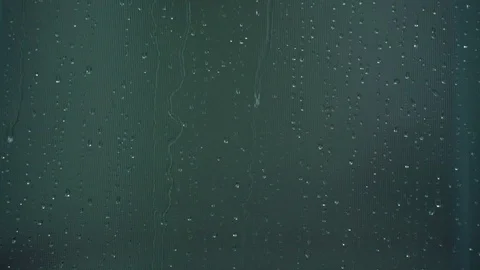 Rain drops running down along window glass close view Stock Footage 117961753