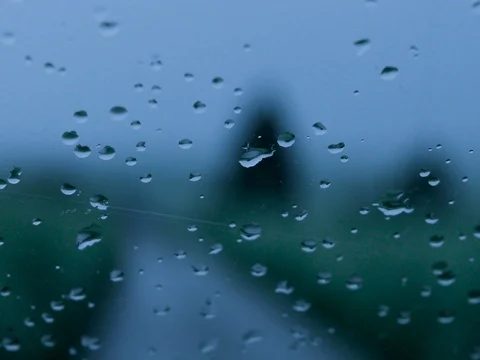 Rain drops running down car window Stock Footage 79190196