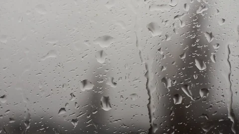 Rain drops running down a window pane. Video stock 86416204