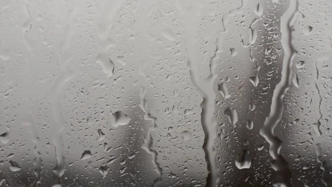 Rain drops running down a window pane. Stock Footage 86416214