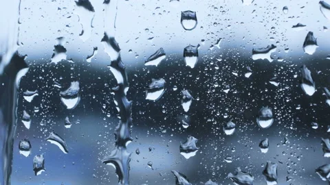 Rain drops running down on a window glass - 4k Video stock 88136476