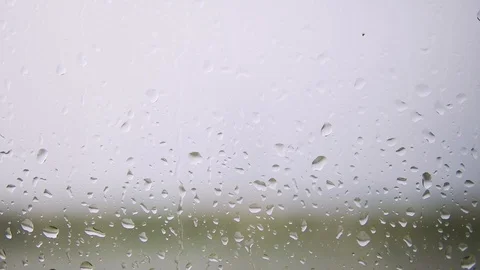 Rain drops running down on a window glass Stock Footage 108775903