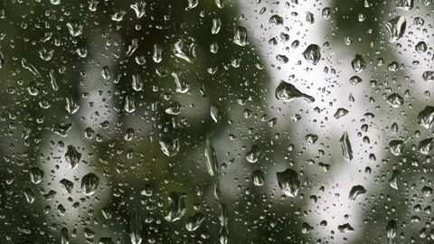 Rain drops running down on of a window glass. Stock Footage 110695009