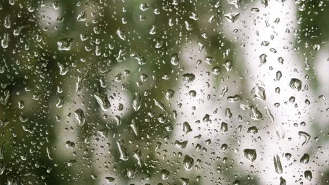 Rain drops running down on of a window glass. Stock Footage 110695137