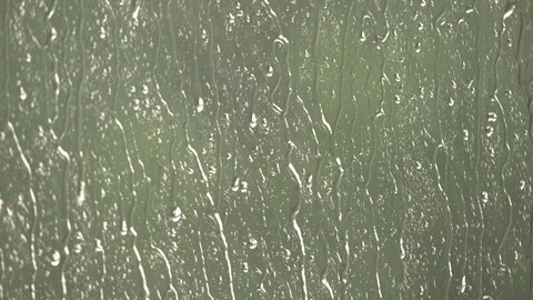 Rain drops running down the window surface. Heavy summer rain outside Stock Footage 112405308
