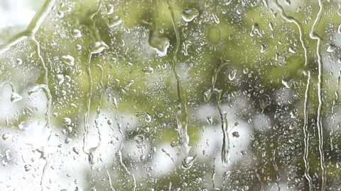 Rain drops running down a window,Rainy Day Video stock 221556864