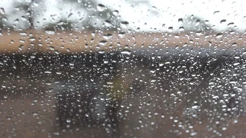 Rain drops running down a window,Rainy Day Stock Footage 227075962