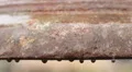 Rain drops on rusty bronze surface of ancient church bell, cultural heritage HD Footage