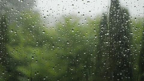 Rain Drops Sliding on Window Glass. Heavy Rain With Gusts of Wind Pours Thr.. Video stock 330129012
